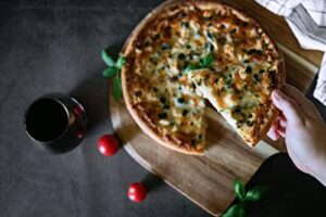 High-quality 16”x 20” baking pizza steel with finger holes, rounded edges, and a sandblasted finish for even heat distribution.  