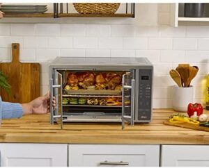 Air Fryer Oven with stainless steel French doors, 10-in-1 cooking functions, and XL capacity for 2 pizzas  
