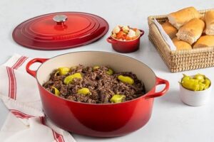 Le Creuset Enameled Cast Iron Signature Oval Dutch Oven, 8 qt., Cerise – A durable and versatile Dutch oven for slow cooking, braising, and roasting.  