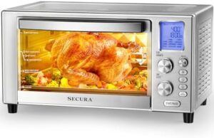 Secura 23 Quart FlashFry Smart Oven on countertop with food cooking