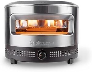 Solo Stove Pi Prime Pizza Oven in action, delivering crispy pizza in 90 seconds with its panoramic opening and cordierite stone.